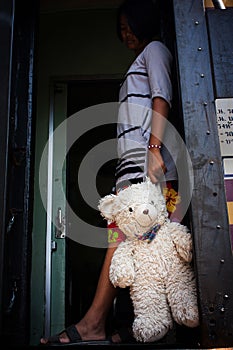 gril standing alone at inner train photo