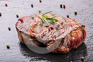 Grill beef steak. Portions thick beef juicy sirloin steaks on grill teflon pan or old wooden board photo