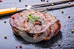 Grill beef steak. Portions thick beef juicy sirloin steaks on grill teflon pan or old wooden board