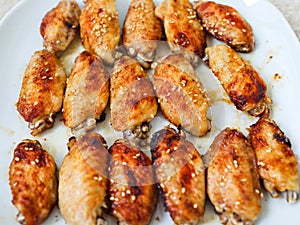 Grill chicken buffalo wings close up, macro party food on white plate, white background