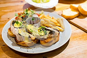 Grill fish on the toast with French fry in restaurant