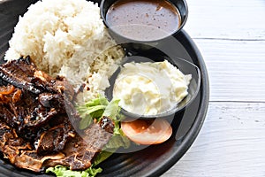 Grill Lamb with Rice and gravy on the plate