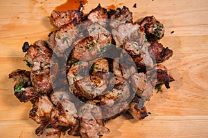 Grill meat on a wooden plate