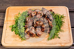 Grill meat on a wooden plate