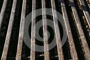 Grill of old rusty rails on a farm