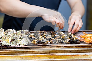 Grill oyster and clam on metal net