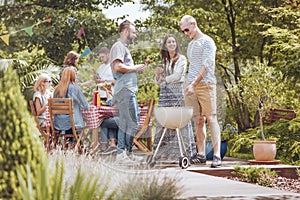 A grill party on the patio. Group of friends enjoying their time