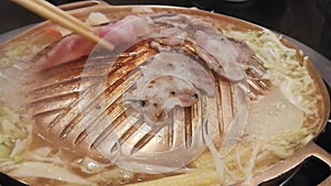 Grill pork , Close up of Meat grilled on brass pan.