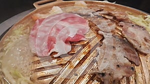 Grill pork , Close up of Meat grilled on brass pan.