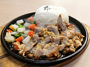 Grill pork slice on the hot BBQ pan with vegetable serve with rice, stir fried pork with garlice, lunch set meal, ready to eat, qu