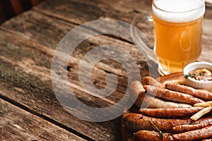Grill sausages mix with beer, free space on wood