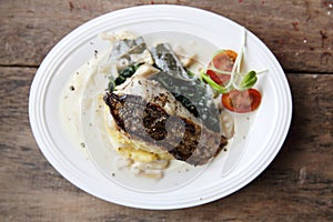 Grill sea bass fillets with crushed potatoes