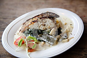 Grill sea bass fillets with crushed potatoes