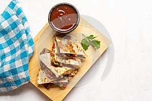 Grill steak mulitas with fresh sauce and cheese on white background. Mexican food