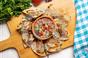 Grill steak mulitas with fresh sauce and cheese on white background. Mexican food