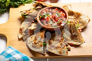 Grill steak mulitas with fresh sauce and cheese on white background. Mexican food