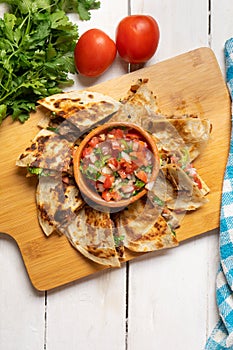 Grill steak mulitas with fresh sauce and cheese on white background. Mexican food