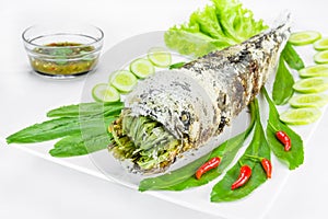 Grill striped snakehead fish with salt coated