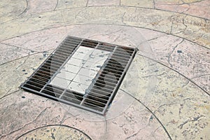 Grille drain of sewer around the street or walkway . Water recirculation system. Wastewater treatment.