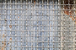 Grille grunge rusty metal zinc wall. Industrial Background and texture in retro concept.