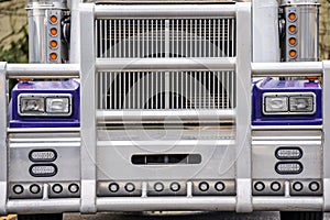 Grille guard and front part of big rig classic blue powerful semi truck