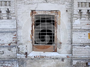 Lattice on the window in an old ruined house