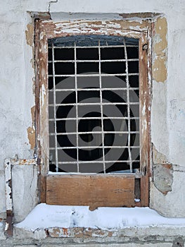 Lattice on the window in an old ruined house