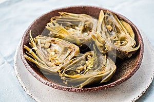 Grilled artishoke  flat lay on white background