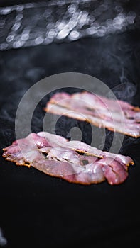 Grilled bacon slices, barbecue, steam