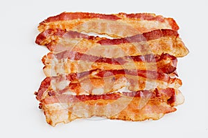 Grilled bacon slices isolated on white background