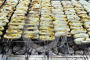 Grilled bananas on skewers on hot charcoal stove, grilled in traditional Thai style Thai street food Thai snacks. Banana Roasted