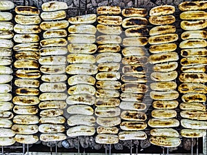 Grilled bananas on skewers on hot charcoal stove, grilled in traditional Thai style Thai street food Thai snacks. Banana Roasted