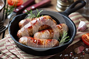 Grilled banges or sausages in a pan