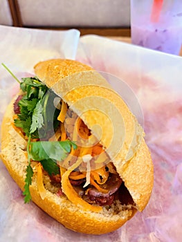 Grilled Beef Banh Mi Vietnamese Sandwich with Carrots and Cilantro