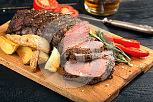 Grilled beef on a cutting board