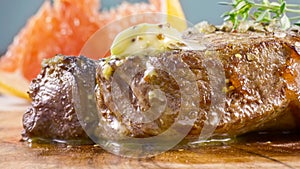 grilled beef fillet steak meat with rosemary isolated on table