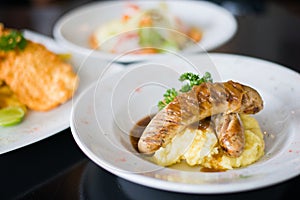 Grilled beef sausages with mashed potato