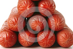 Grilled beef sausages over white