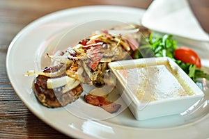 Grilled beef shishkabobs on table close up