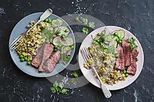 Grilled beef steak and quinoa corn mexican salad on dark background, top view. Delicious healthy balanced food