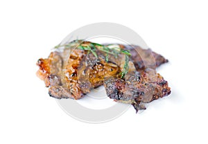 Grilled beef steak and rosemary isolated on white background