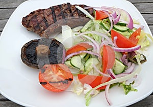 Grilled beef steak and salad