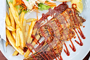 Grilled beef steak with salad on a plate