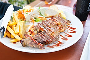 Grilled beef steak with salad on a plate