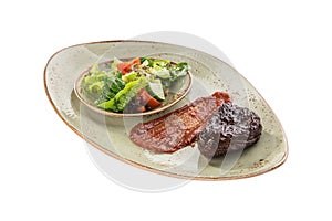 Grilled Beef Steak with tomato sauce and fresh vegetable salad isolated on white background