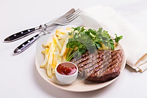 Grilled beef steak with tomatoes, french fries. Barbecue, bbq me