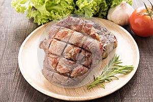 Grilled beef steak and vegetable on a wooden background