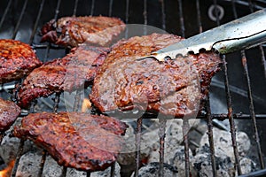 Grilled beef steaks on BBQ grill