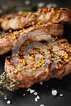 Grilled beef steaks with spices