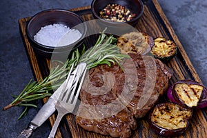 Grilled beef striploin steak and vegetables